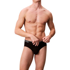 Image 2 : Vue de face des slips Calvin Klein Underwear homme noirs avec bande jacquard logo blanche sur la ceinture élastique — Delvale