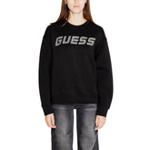 Image 1 : Sweat col rond Guess Active femme noir avec logo strass argenté sur mannequin — delvale