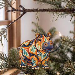Laser-cut maple wood Hippopotamus folk art ornament O370 hanging on a fir branch, made in USA