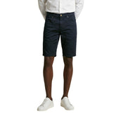 Image 1 : Bermuda homme Jeckerson bleu marine coupe slim 5 poches vue de face porté avec chemise blanche — Delvale