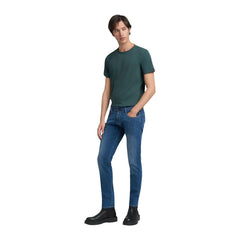 Image 3 : Vue latérale du jean slim Replay homme denim stretch bleu, coupe ajustée sur la jambe — Delvale