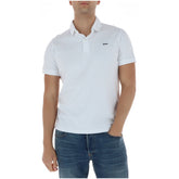 Image 1 : Polo homme Superdry blanc piqué manches courtes, vue de face portée, logo brodé sur la poitrine — Delvale