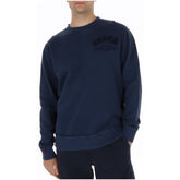 Image 1 : Sweatshirt col rond Superdry homme en coton bleu marine, logo tonal arqué sur la poitrine, vue de face portée — Delvale