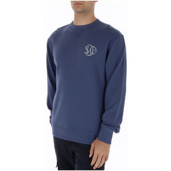Image 3 : Détail du bas du sweatshirt Superdry homme avec bande côtelée et étiquette tissu signature de la marque — Delvale