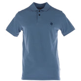 Image 1 : Polo homme Timberland en piqué coton bleu azur, vue de face avec logo arbre brodé sur la poitrine gauche et col deux boutons — Delvale
