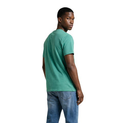Image 3 : T-shirt Tommy Hilfiger Jeans homme vert porté, vue de profil — Delvale