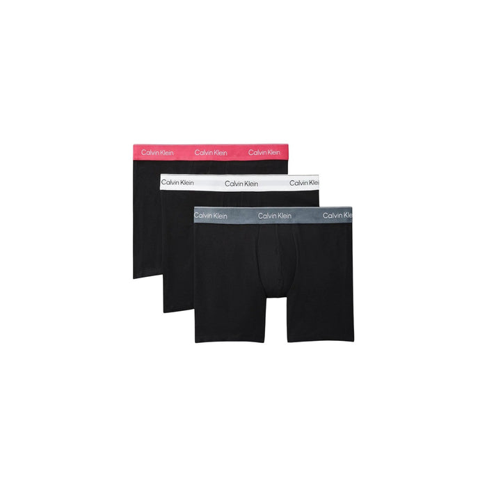 Image 1 : Pack de 3 boxers longs Calvin Klein Underwear homme noirs avec ceintures logotées rose, blanche et grise, vue face — Delvale
