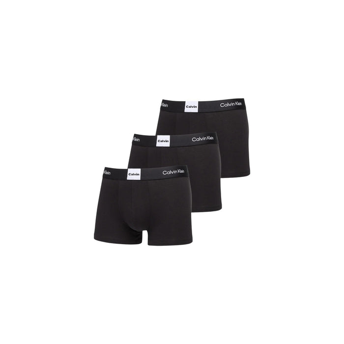 Image 1 : Lot de 3 boxers Calvin Klein Underwear homme noirs, vue de face empilés, ceinture élastique siglée Calvin Klein visible — Delvale