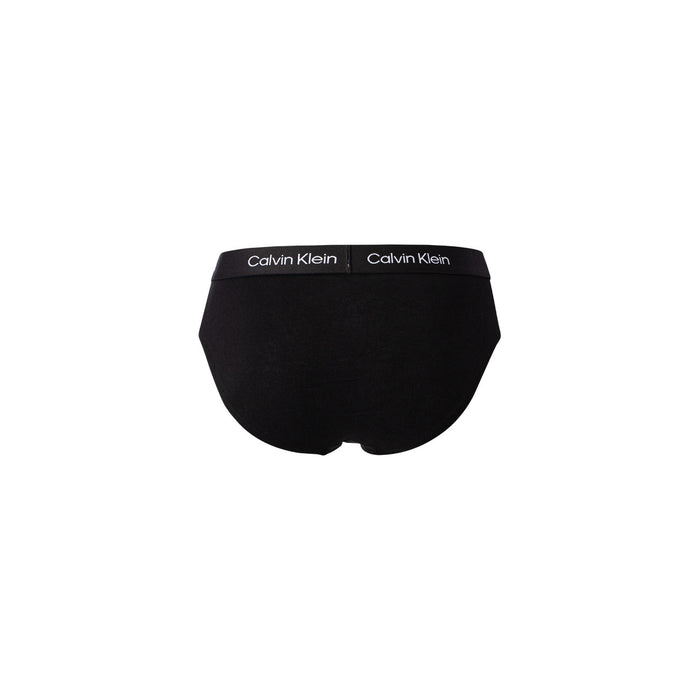 Image 3 : Trois slips Calvin Klein hip brief noirs disposés côte à côte, ceinture élastique siglée CK visible — Delvale