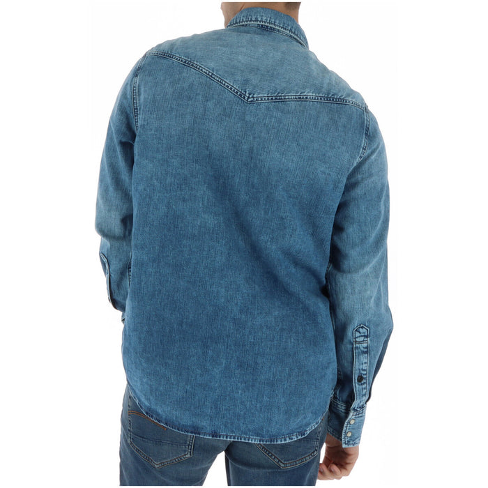 Image 2 : Vue de face chemise denim G-Star RAW homme col classique fermeture boutons et badge logo doré — Delvale