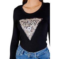 Image 2 : Détail du logo triangle Guess serti de strass et brodé sur fond noir, t-shirt femme manches longues — Delvale