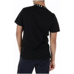 Image 2 : Vue de face du t-shirt Icon homme noir à manches courtes avec inscription ICON brodée au col, style casual premium — Delvale
