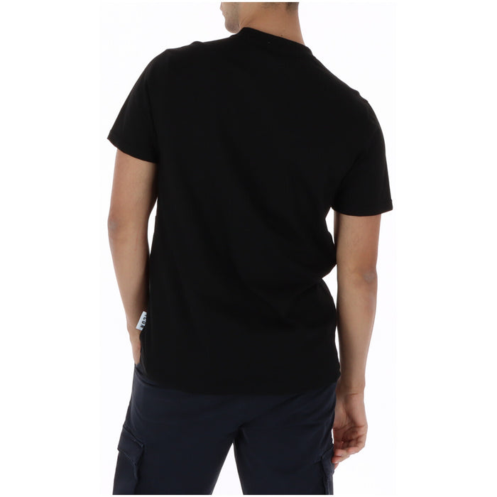 Image 2 : Vue de face du t-shirt Icon homme noir à inscription graphique large sur la poitrine, porté avec un pantalon marine — Delvale