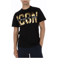 Image 1 : T-shirt homme Icon noir avec grand print doré métallisé ICON et inscription Be Unique Be Iconic, porté de face — Delvale