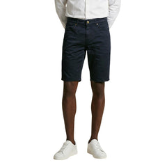 Image 1 : Bermuda homme Jeckerson bleu marine coupe slim 5 poches vue de face porté avec chemise blanche — Delvale