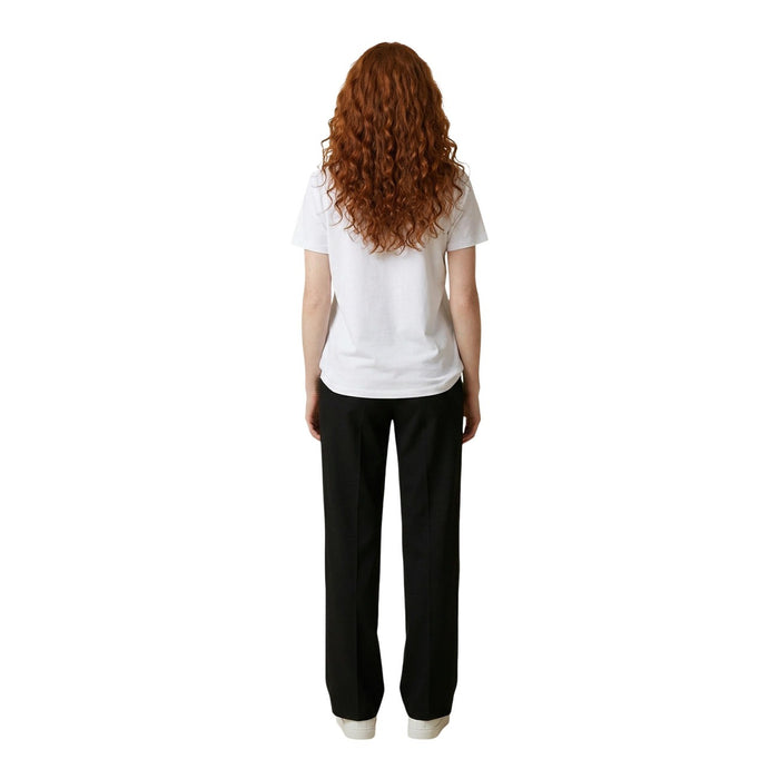 Image 3 : T-shirt femme Liu Jo blanc logo strass doré porté avec un pantalon noir, look casual chic — Delvale