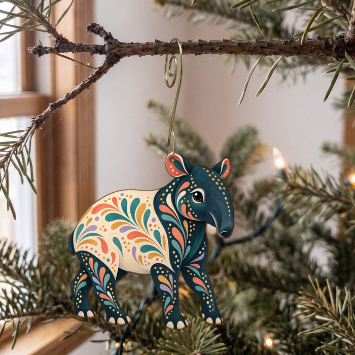 Laser-cut maple wood Malayan Tapir folk art ornament O375 hanging on a fir branch, made in USA