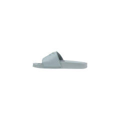Image 4 : Vue de profil des mules Pinko femme PVC vert sauge, semelle et bandeau structuré visible — Delvale