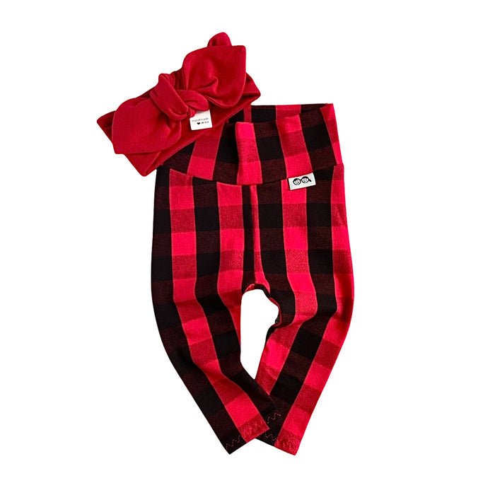 Handmade red buffalo plaid leggings paired with a matching solid red bow headband for babies and toddlers.