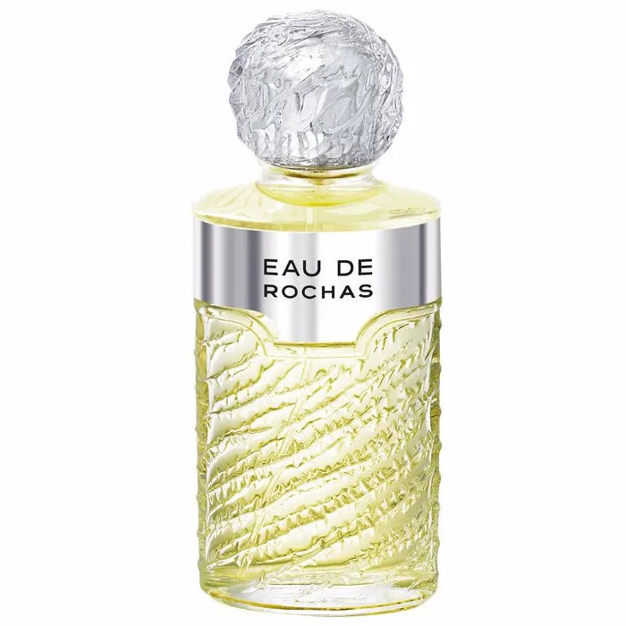 Image 1 : Flacon Rochas Eau de Rochas Eau de Toilette Vaporisateur 100ml, design en verre texturé jaune pâle avec bouchon sphérique givré argenté et bandeau argenté estampillé Eau De Rochas — Delvale