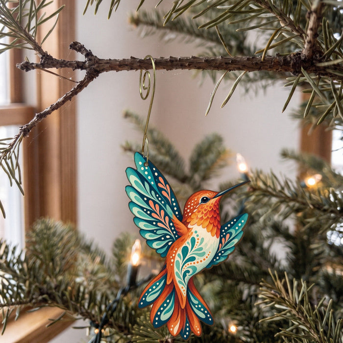 Laser-cut maple wood Rufous Hummingbird folk art ornament O329 hanging on a fir branch, made in USA